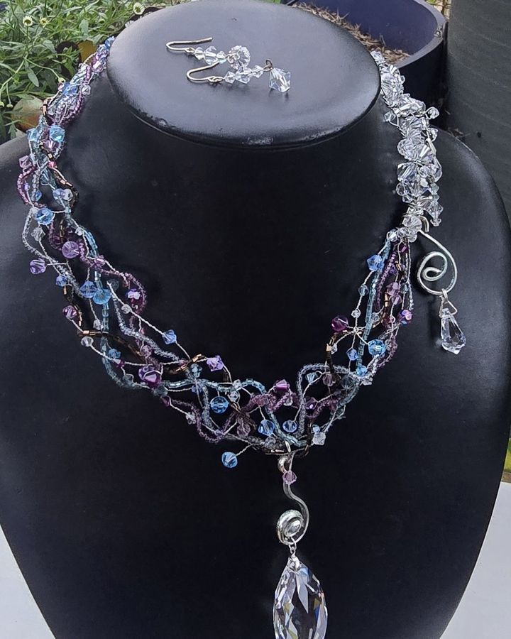 Fairy Swirls blue and violet beaded necklace with a clear crystal drop