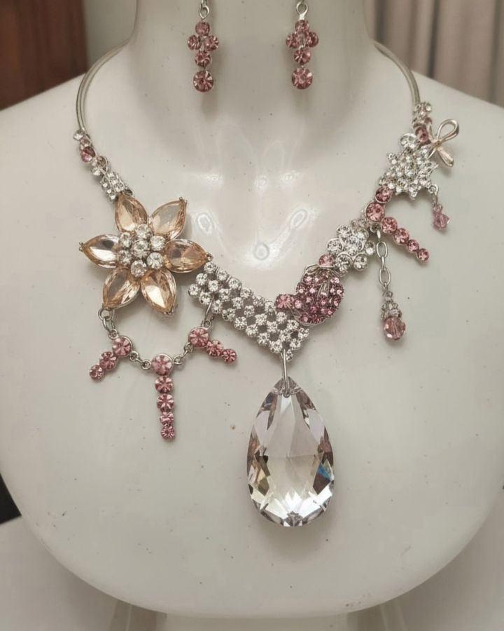 Sparkling Debutante with a champagne flower and pink crystal drops