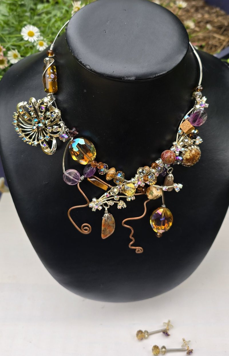 Outback Beauty Necklace: vintage brooch, amber and amethyst crystals, picture jasper and copper wire spirals on a black bust
